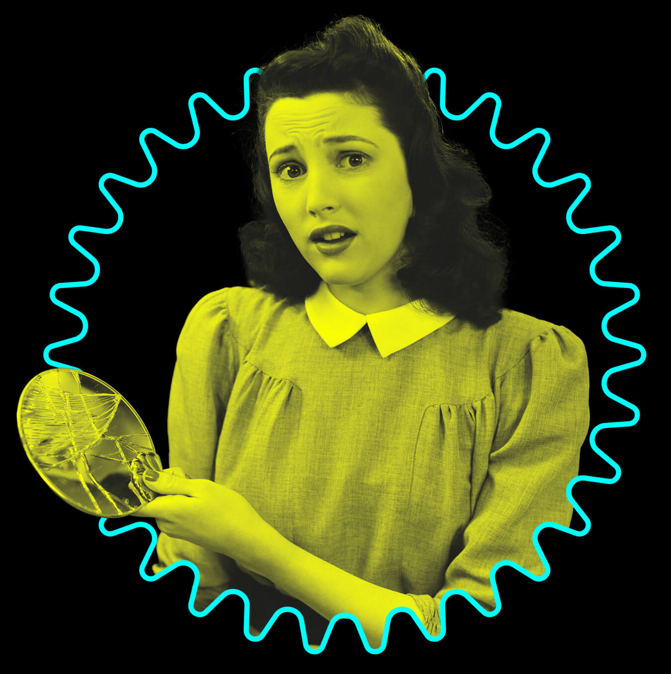 Woman with worried expression holding a broken hand mirror